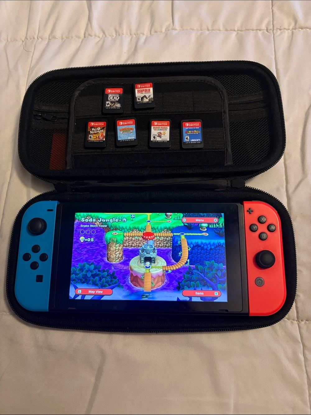 Nintendo Switch with Neon Blue & Neon Red Joy‑Con in Protective Case w/ 7 games